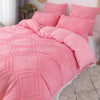 Pink bohemian grid tufted duvet cover set with matching pillows and a pink duvet