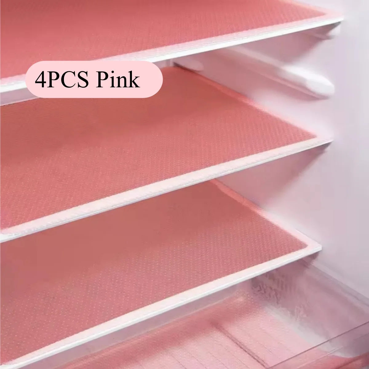 Four pink reusable silicone fridge and drawer liners displayed in a white shelving unit.
