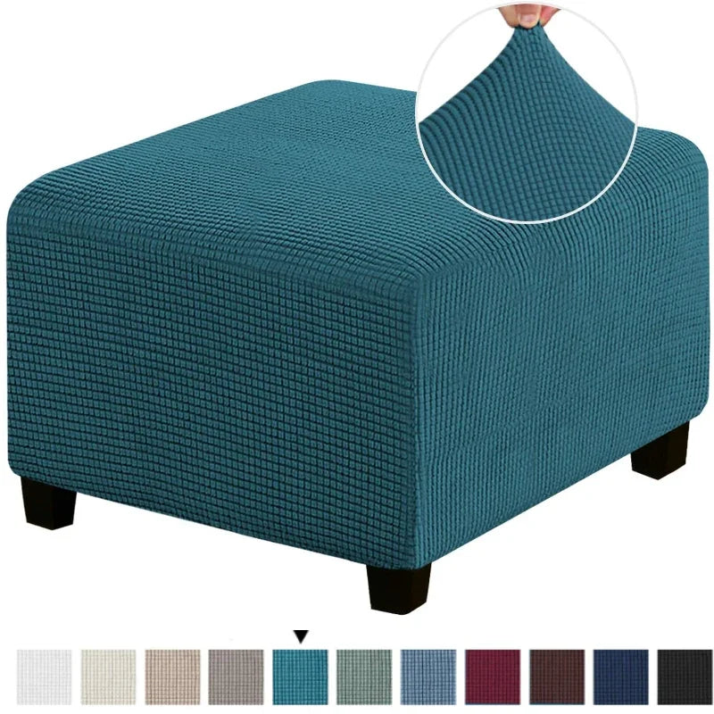 A teal square jacquard footrest ottoman slipcover with a textured fabric and wooden legs.