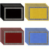 A set of five solid linen blend table placemats in black, yellow, and blue with Greek key borders.