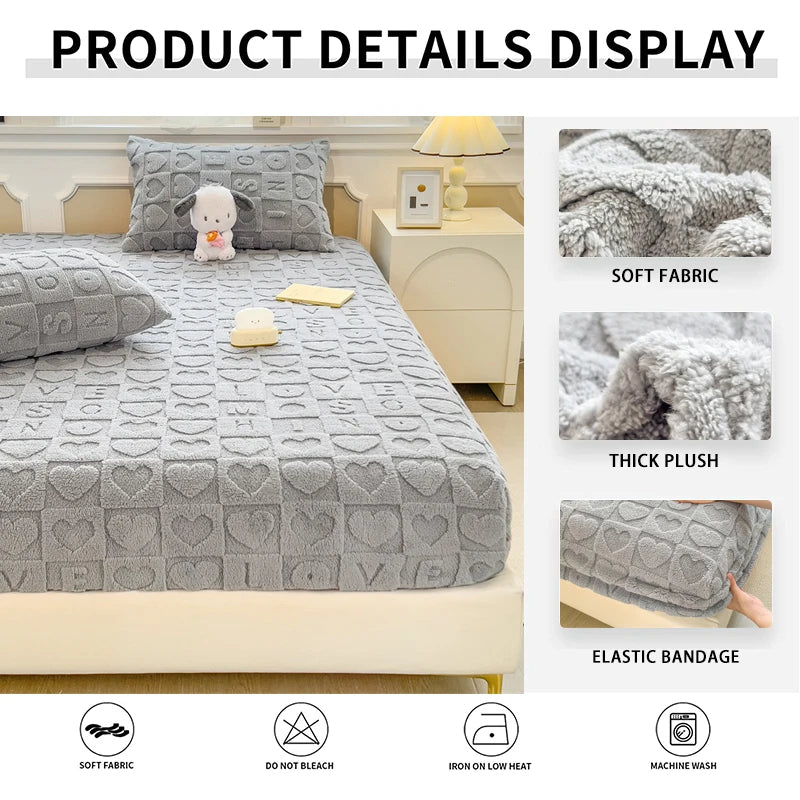 A gray plush jacquard mattress cover displayed on a bed, showing details like soft fabric and elastic bandage.