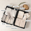 A black travel storage organizer set featuring various bags including makeup bag, shoe bag, and garment bags in beige and cre