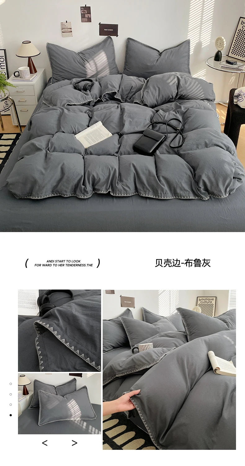 A gray quilted bed linen set featuring a duvet and pillows displayed on a bed.