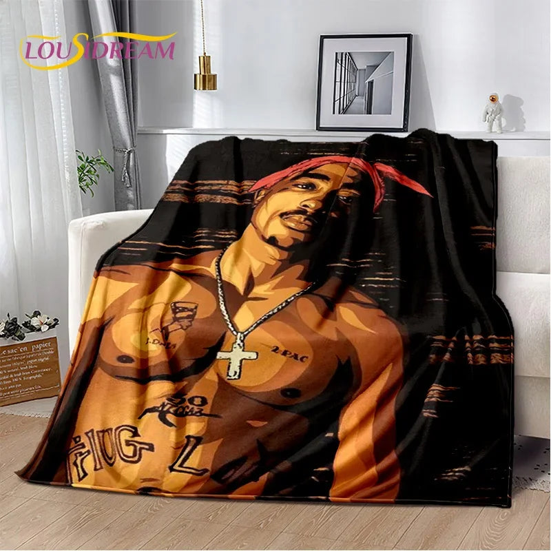 A vintage-inspired graphic throw blanket featuring a portrait of a man in an orange and black color scheme.