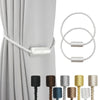 A set of magnetic curtain tiebacks in various colors and finishes, including a long cord and short magnetic clips.