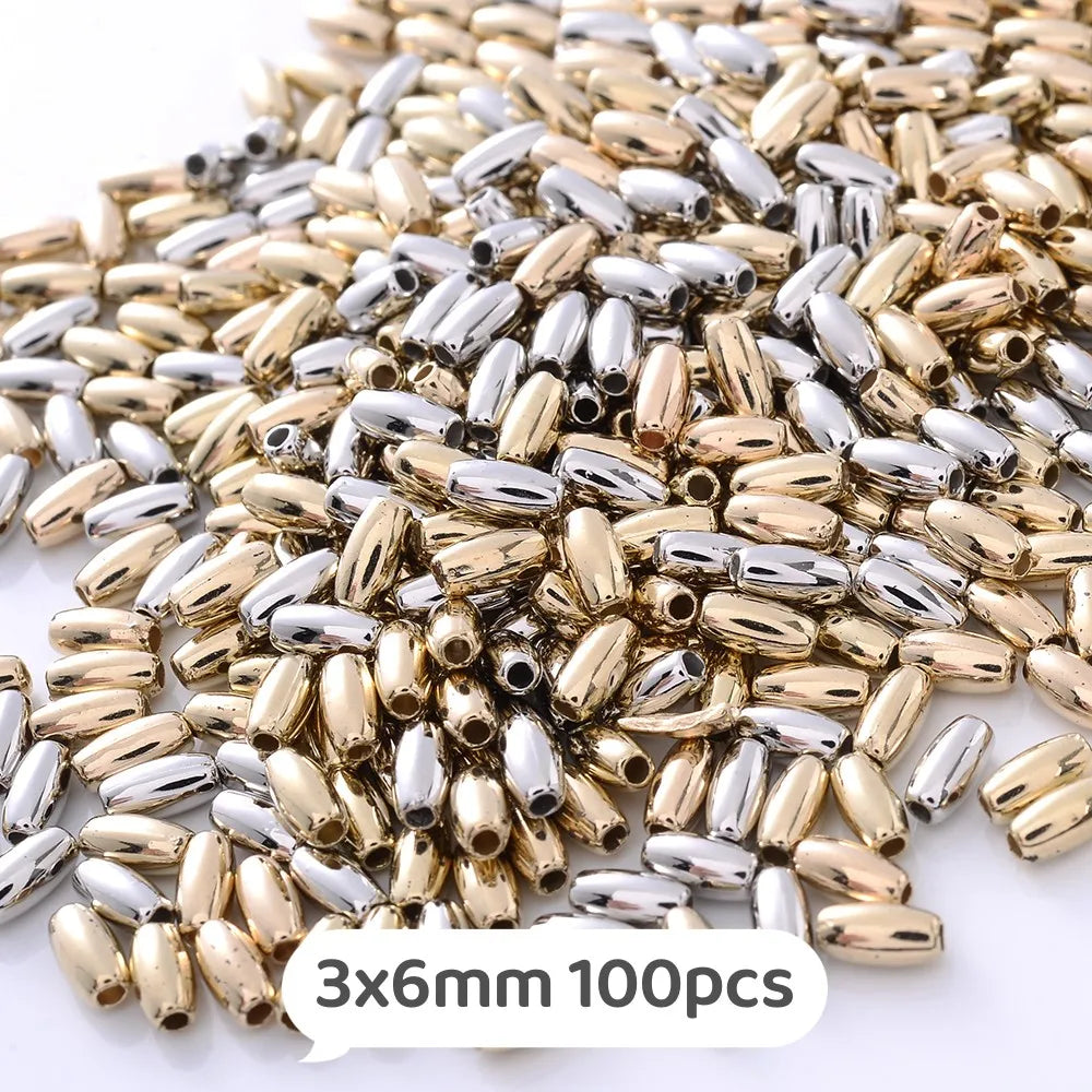 A pile of mixed gold and silver geometric acrylic beads for jewelry making