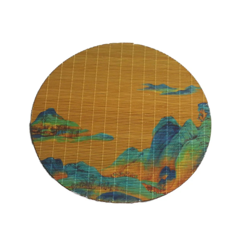 Hand-woven multicolor bamboo tea mat with a textured surface featuring abstract landscape colors.