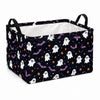 A black fabric storage basket with white and purple ghost and bat patterns, featuring handles.