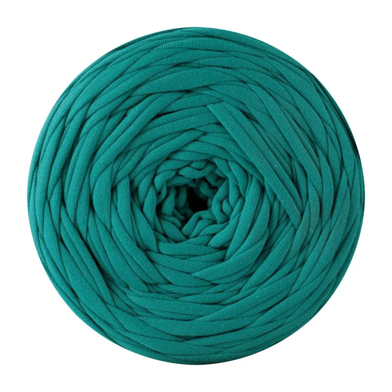 A ball of teal green soft T-shirt yarn for crochet