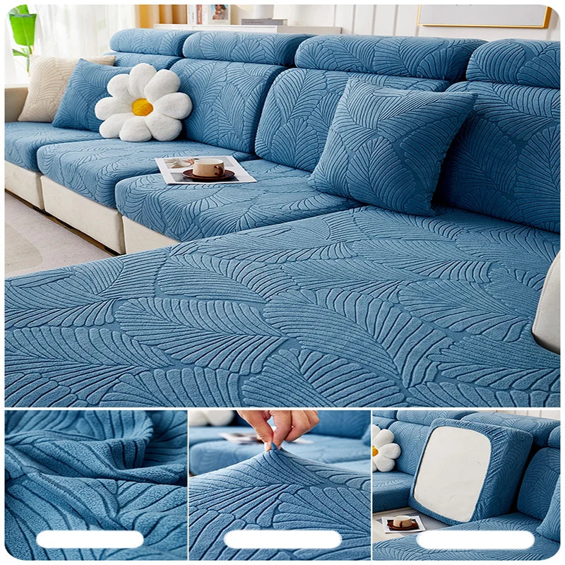 A teal leaf jacquard stretch sofa cover with anti-slip backing shown on a sectional sofa.