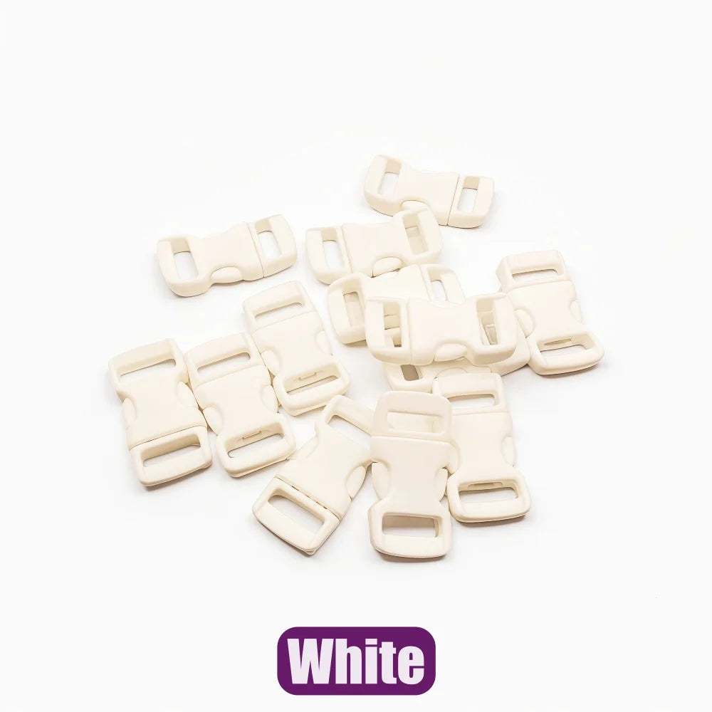 A collection of white adjustable plastic paracord buckle bracelets laid out on a white background.