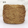 A ball of metallic gold silk crocheting and knitting yarn.