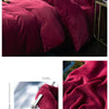 A deep burgundy luxurious flannel duvet cover set displayed on a bed.