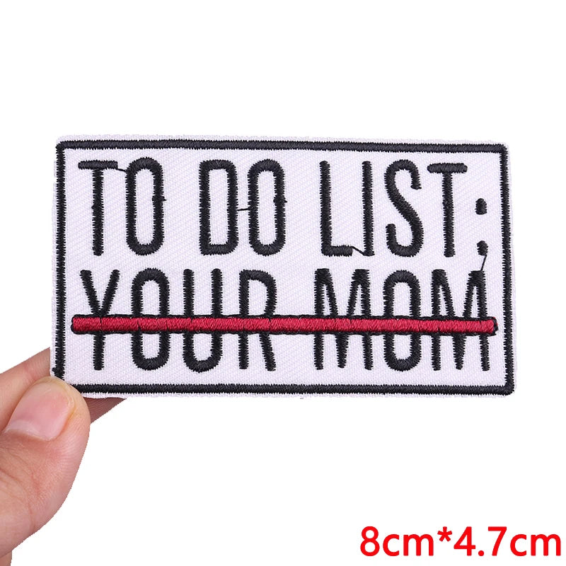 Black embroidered patch with the text TO DO LIST YOUR MOM in black and red thread.
