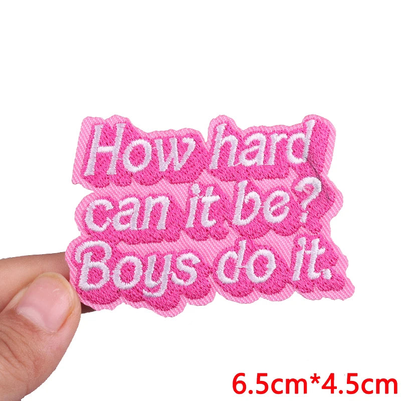Pink embroidered iron-on patches with text asking how hard it can be and boys do it