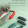 A silicone anti-scald pot handle cover in red is shown protecting a metal pot handle.