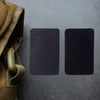 Two dark gray tactical embroidered morale and hook-and-loop patches are displayed on a dark surface.