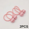Two pink minimalist magnetic ball curtain tiebacks with pink elastic loops