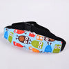 A black adjustable baby car seat head support featuring colorful animal designs on the fabric.