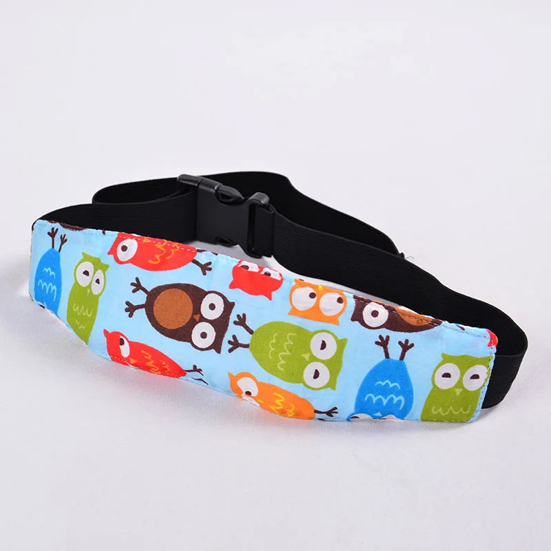 A black adjustable baby car seat head support featuring colorful animal designs on the fabric.