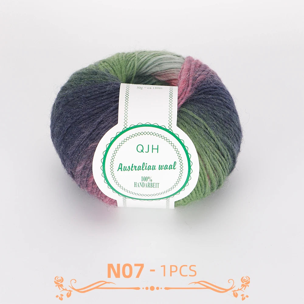 A ball of multi-colored wool yarn with shades of green, purple, and pink.