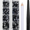 A clear plastic case containing various sizes of dark blue and silver crystal hot fix rhinestones with an applicator tool.