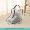 A clear mesh portable boot storage bag with a handle shown on a light carpet.