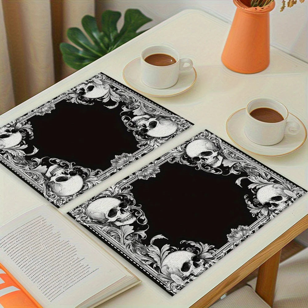 A set of vintage skull placemats featuring a gothic floral mystic cross design placed on a white table.