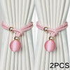 Two pink adjustable French ball curtain tiebacks with gold accents shown against a light background.