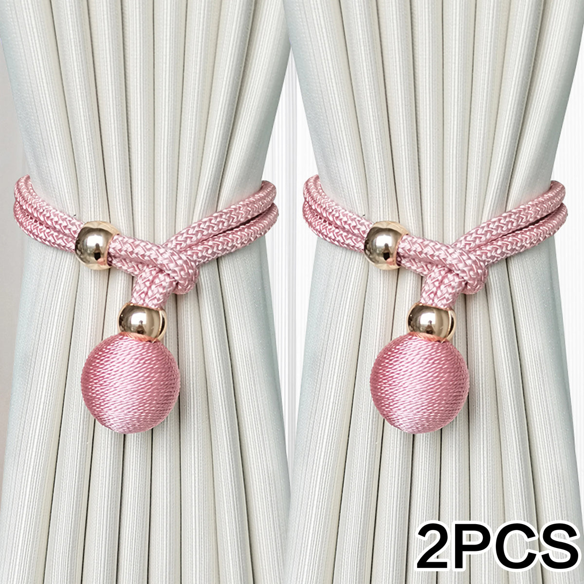 Two pink adjustable French ball curtain tiebacks with gold accents shown against a light background.