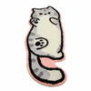 A gray and white cartoon cat plush rug with pink accents.
