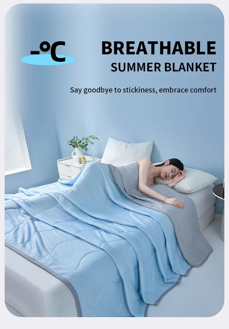 A light blue breathable summer blanket draped over a person lying in bed.