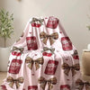 Pink flannel throw blanket featuring a leopard print pattern and decorative bows.