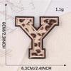 A leopard print iron-on patch shaped like the letter Y, measuring 1.1g and 6.3cm.