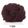 A ball of dark brown hand-woven chunky chenille yarn.
