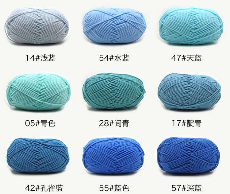 A collection of blue and teal knitting yarns shown in various thicknesses and colors.