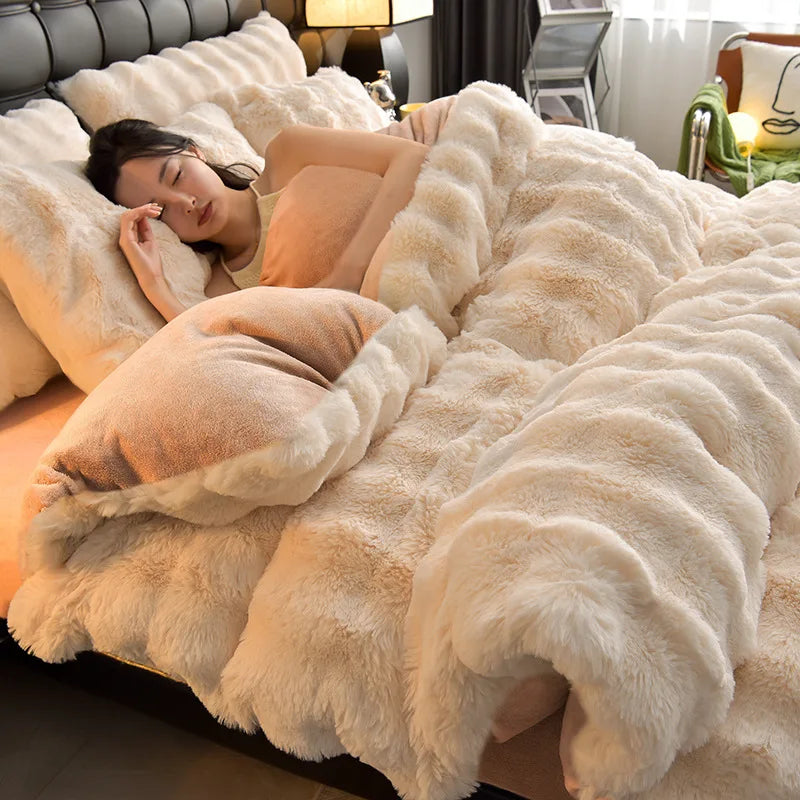 A woman relaxing on a fluffy beige plush rabbit hair bedding set on a bed.