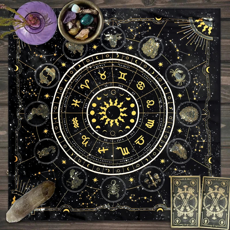 A dark fabric featuring an astrological tarot card layout with celestial symbols and gold accents.