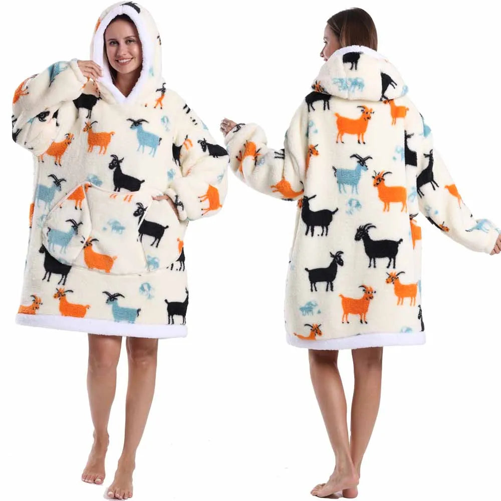 A woman models an oversized patchwork fleece hoodie featuring a white and cream background with colorful animal patches.