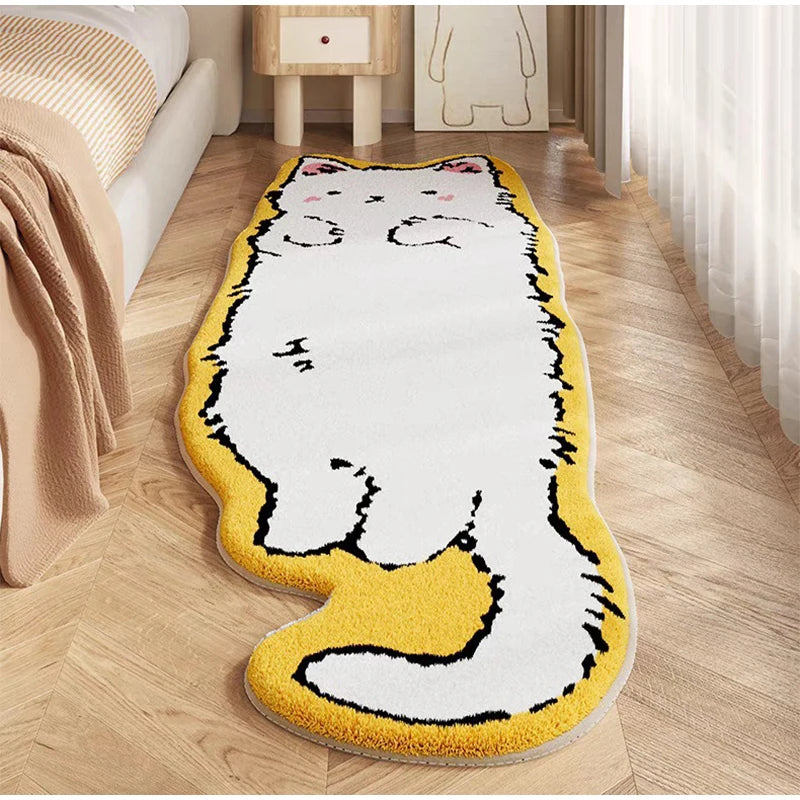 A decorative cat mat featuring a white body with black markings and yellow paws placed on a wooden floor.