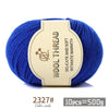 Blue wool thread skein with a label indicating delicate and soft intimate warmth