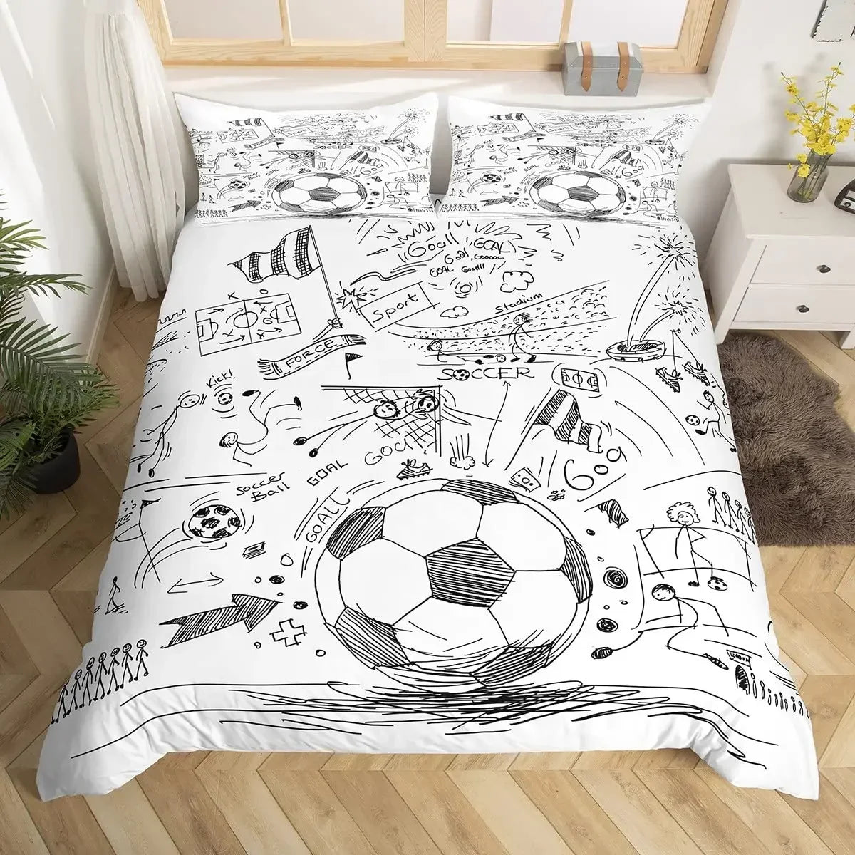 A duvet cover featuring hand-drawn black and white football doodles and soccer themes.