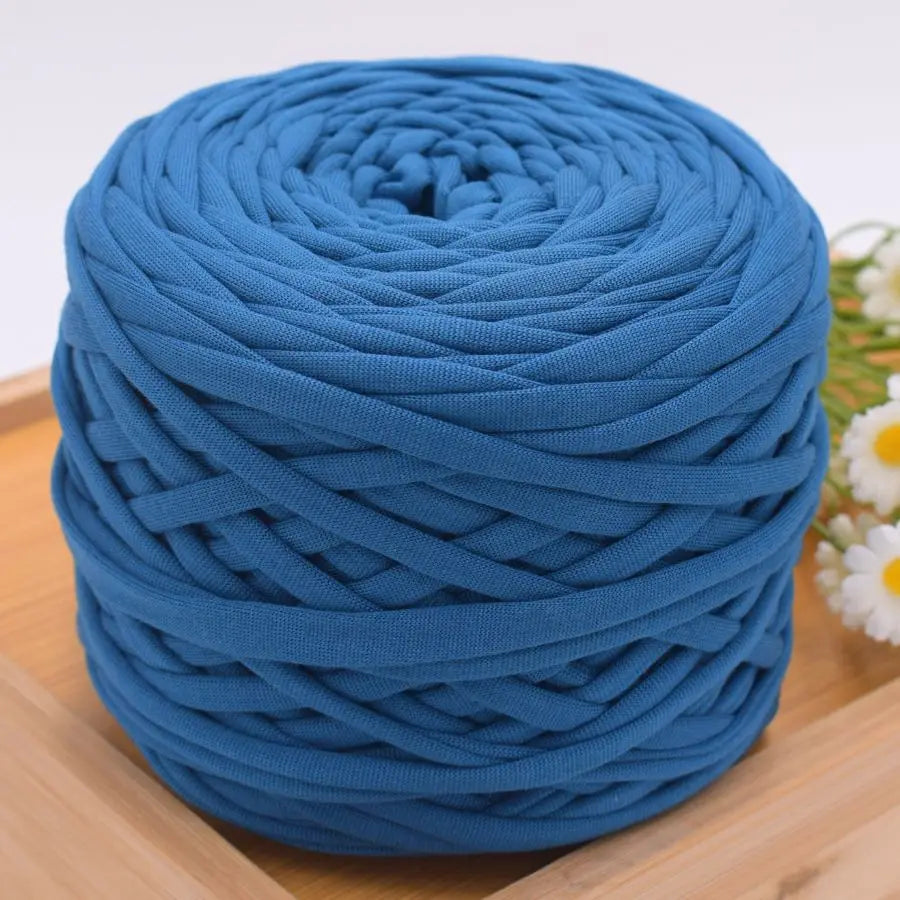 A ball of blue polyester craft yarn used for knitting and DIY projects.