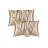 A set of three satin pillowcases in a champagne or beige color with draped fabric texture.