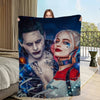 A dark, artistic print featuring two stylized female characters with dramatic makeup and clothing on a blanket.