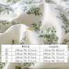 White fabric with green floral print folded and draped