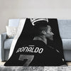 A black and white graphic featuring a profile of Ronaldo wearing a soccer jersey on a wool throw blanket.