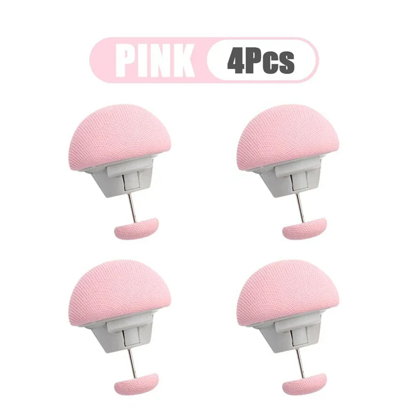 Four pink adjustable quilt and fabric clips shown in various views