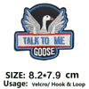 Embroidered patch featuring a white goose with outstretched wings on a black background