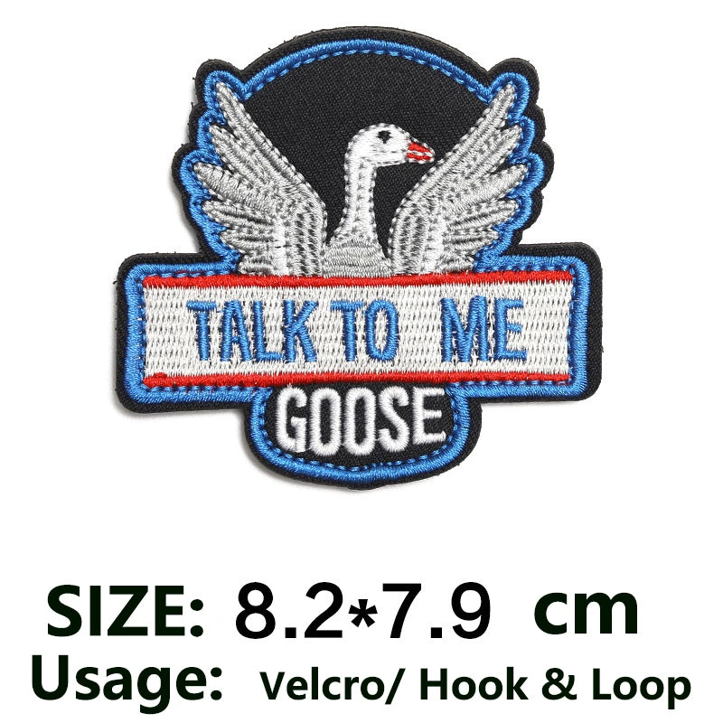 Embroidered patch featuring a white goose with outstretched wings on a black background